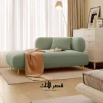 ⁦كنب استرخاء اخضر بتصميم بسيط ومريح⁩ - الصورة ⁦3⁩